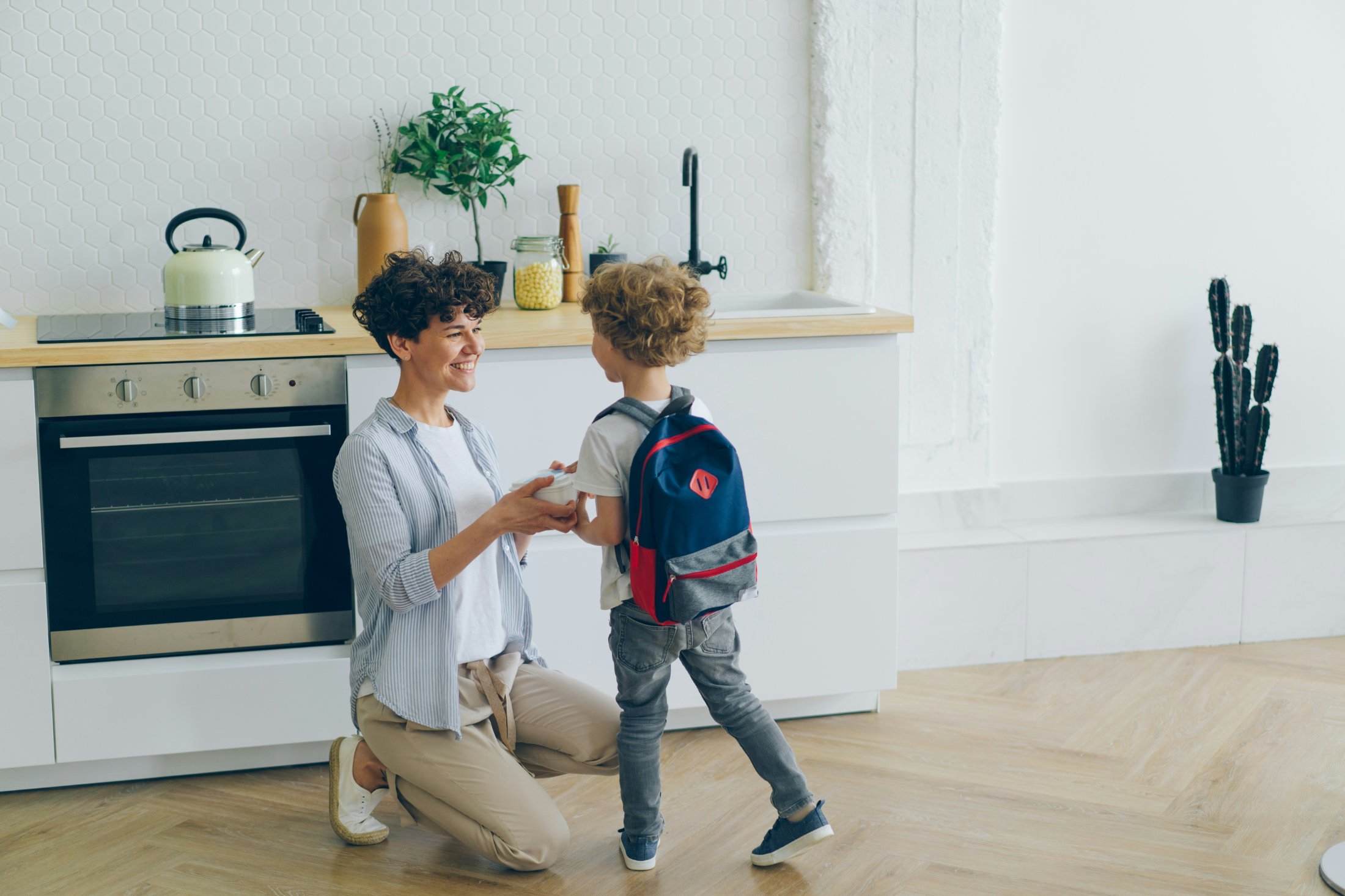 A parent and child getting ready for the school day